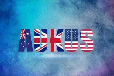 AUKUS with details of UK, Australia and USA flags used in letters